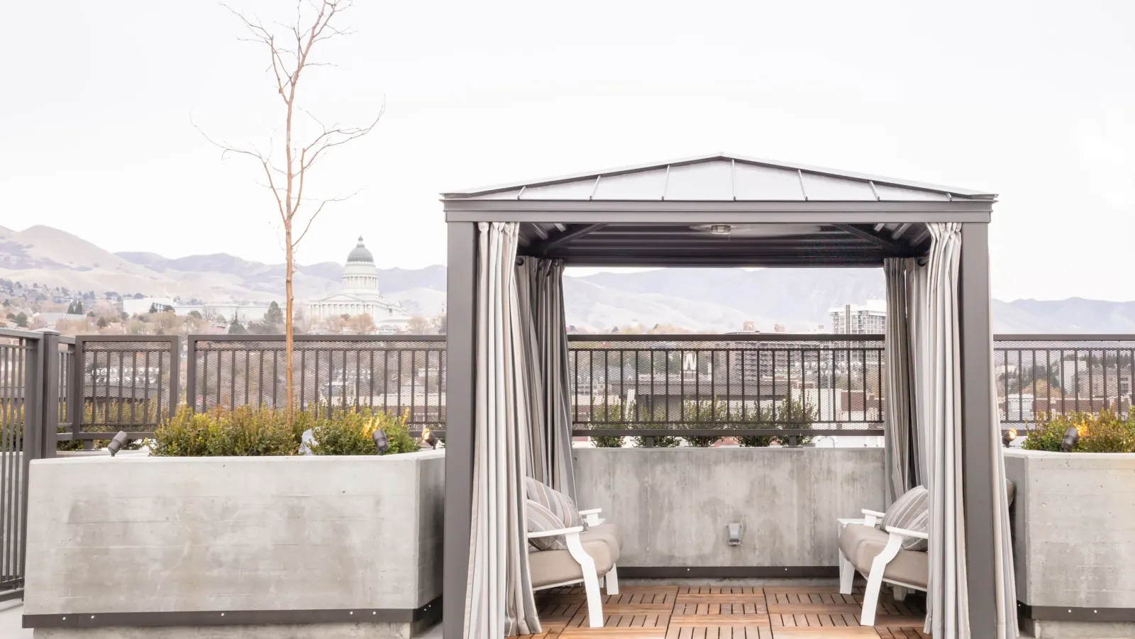 Cabana with a framed skyline view on the rooftop deck