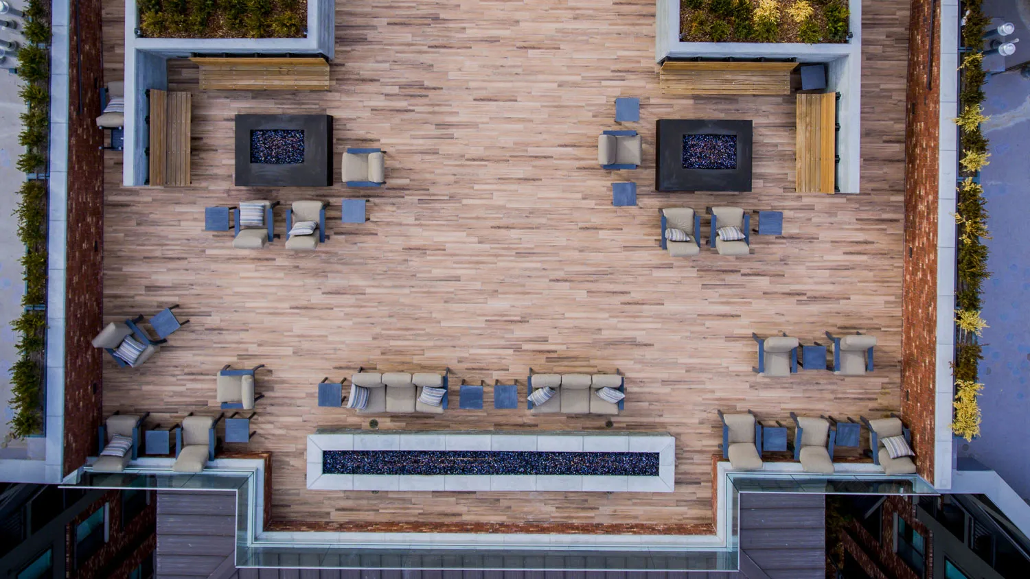 Fire lounge seating on the rooftop deck, read from above