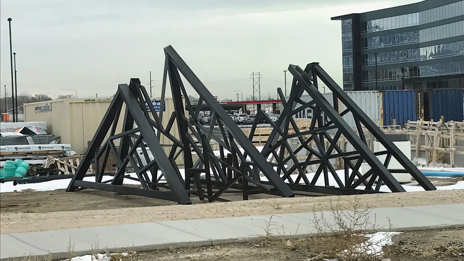 Fabricated steel sections of the shade structure reassembled on the ground