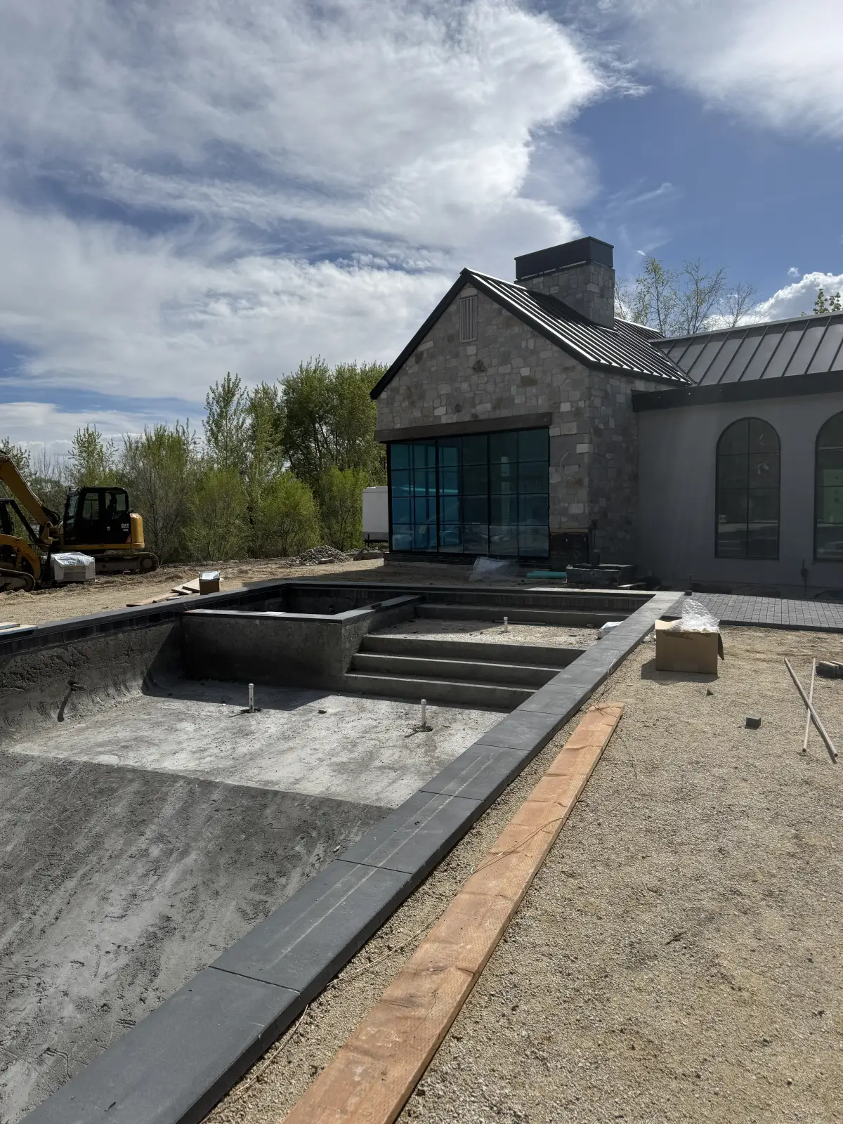 The water feature, before · a raw concrete trough