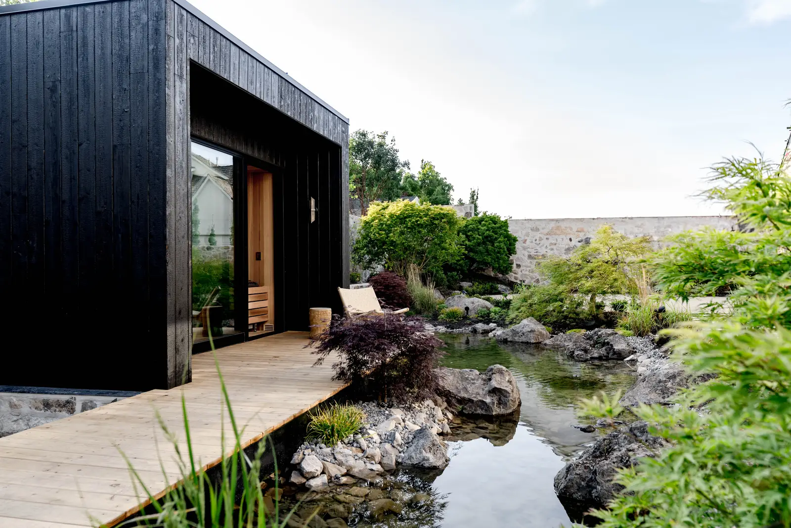 Modern Elm sauna, pond and walkway