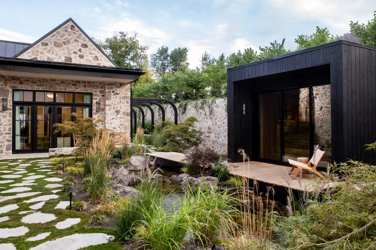 Rear garden, pond, and pavilion at the Modern Elm luxury residence