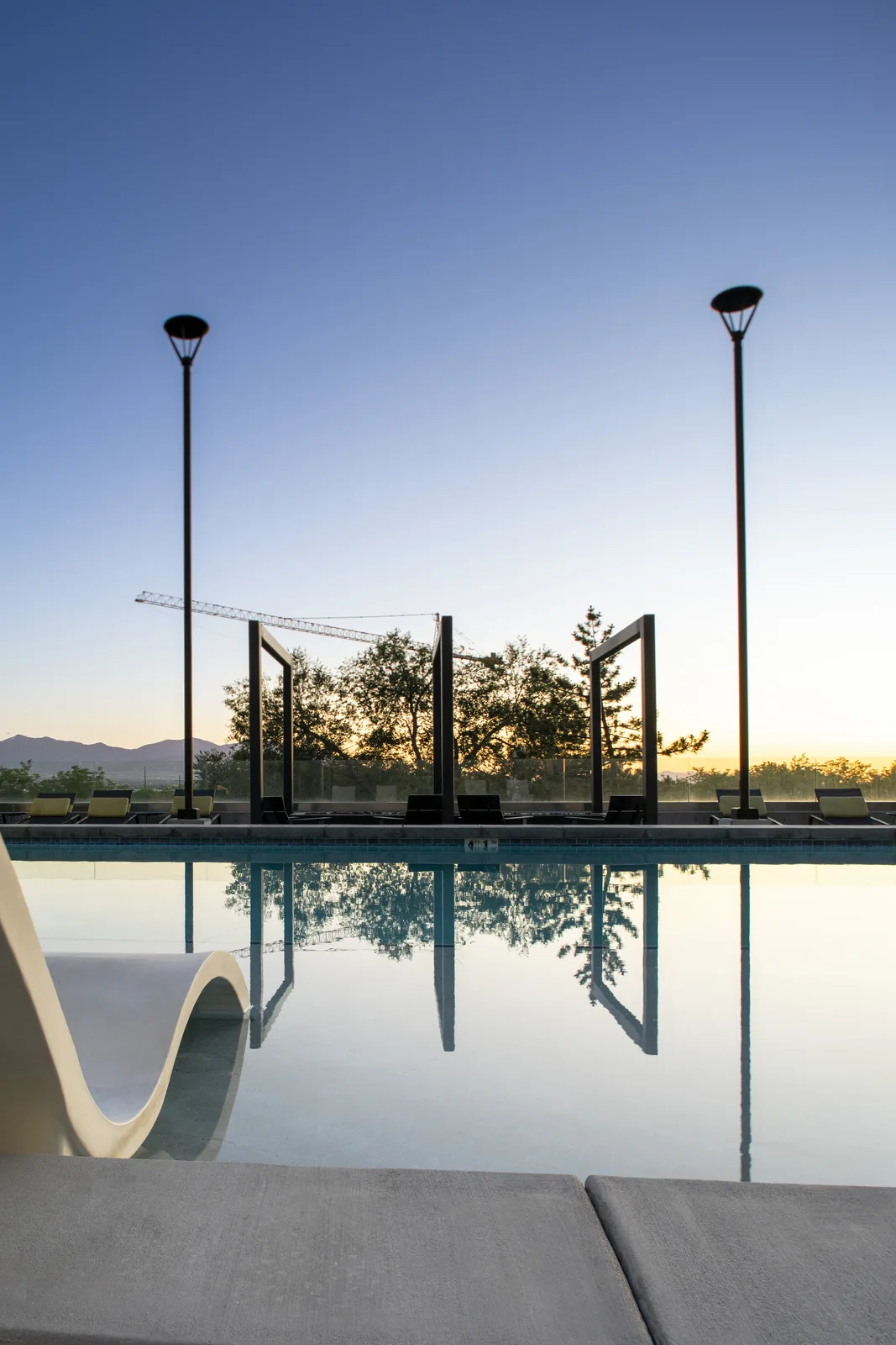 Pool sunset reflection framed vertically