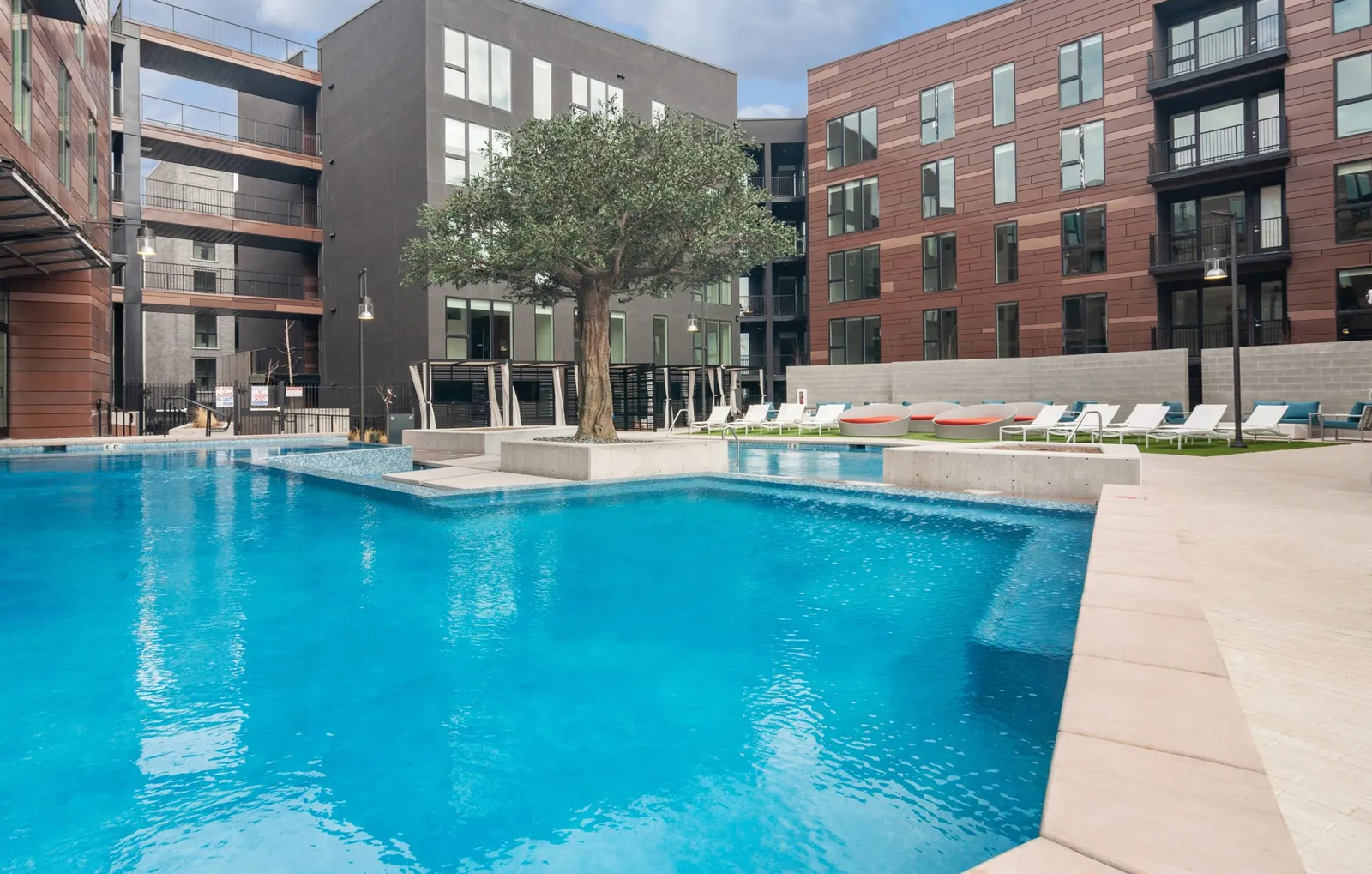 The pool and the steel art tree