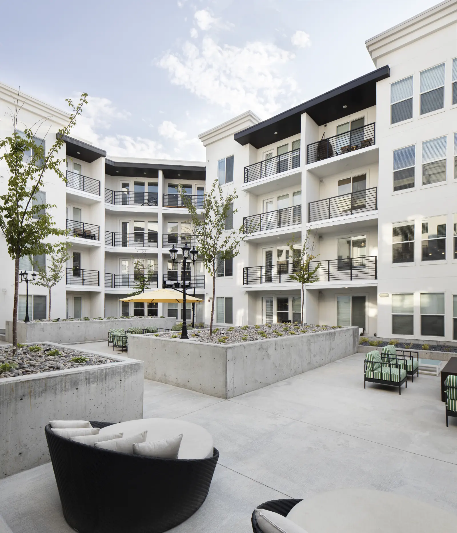 02 · The Lower Levels, Below the rooftop, the courtyards shift the mood.